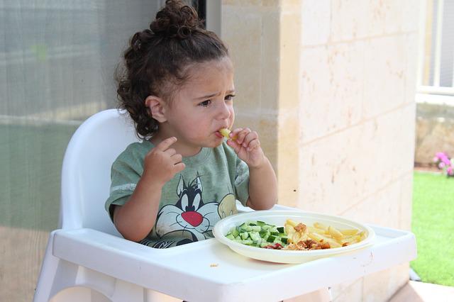 A picture of a healthy child eating food